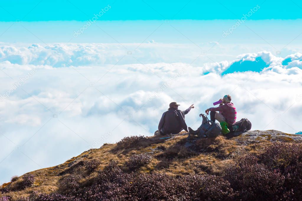 People relaxing on Mountain Cliff 