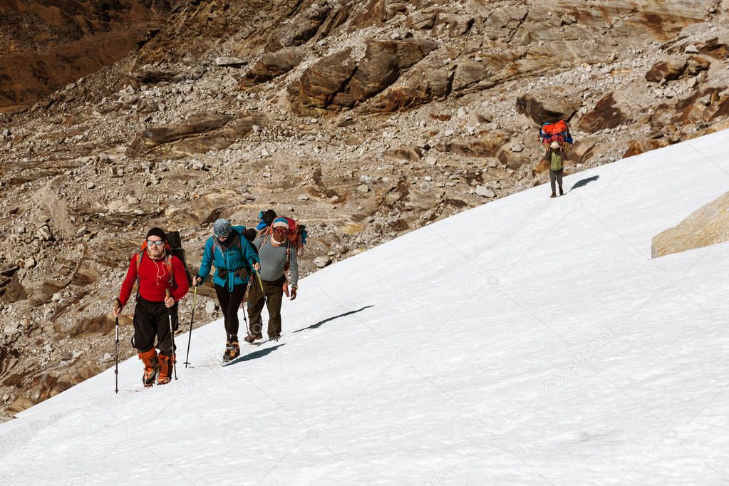 Climbers walking on Snow 