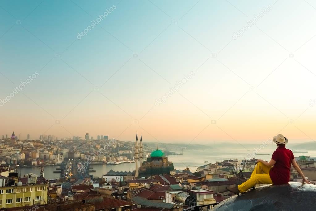 Lady in Hat sitting on Roof