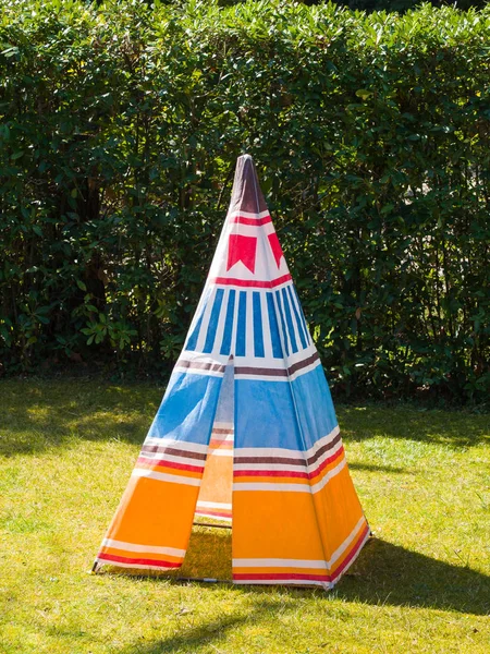 Colorful child's toy Teepee tent on the grass — Stock Photo, Image