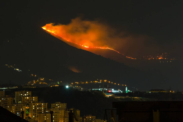 Genoa, Italy, 6 january, 2017: Forest fire in the mountains above the city