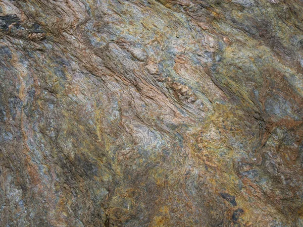 Detail of Metamorphic rocks with colorful mineral streaks.   Tex — Stock Photo, Image
