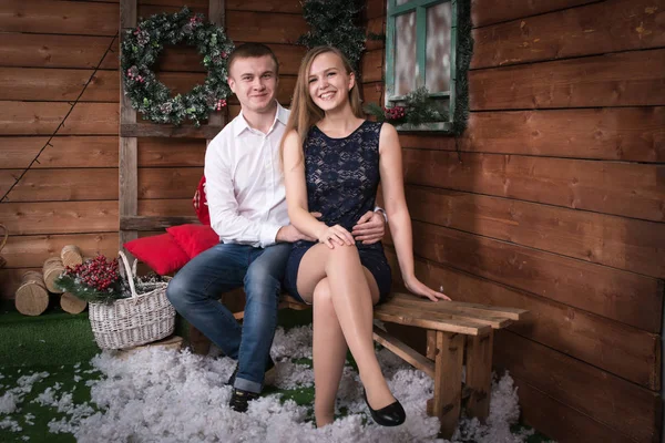 Young couple in the room before Christmas