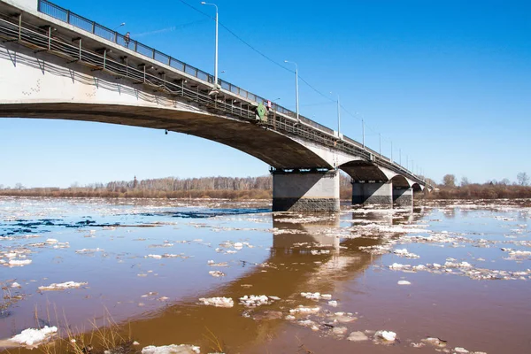 Ice drift on the river and the bridge