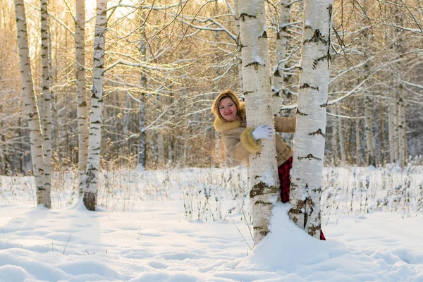 Woman in the forest in a winter day