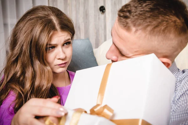 Couple in the room with the gifts