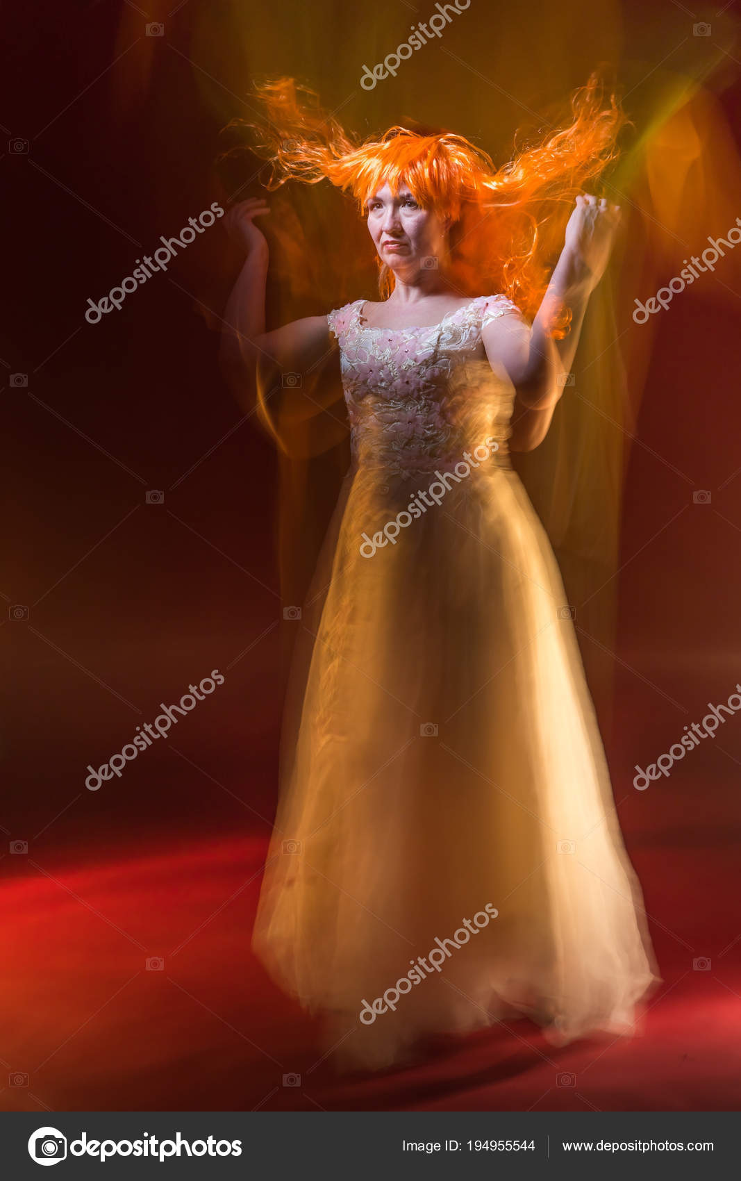 Old Female Actress With Orange Hair Dancing In White Dress With