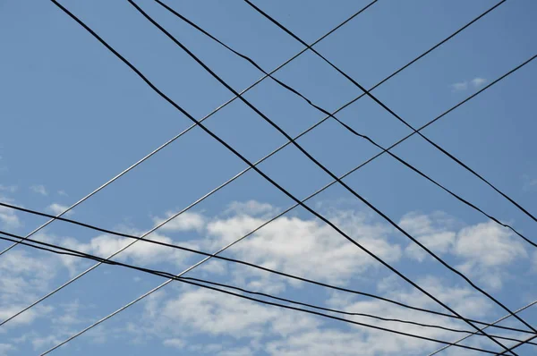 Electric cable wire intersection on sky background — Stock Photo, Image