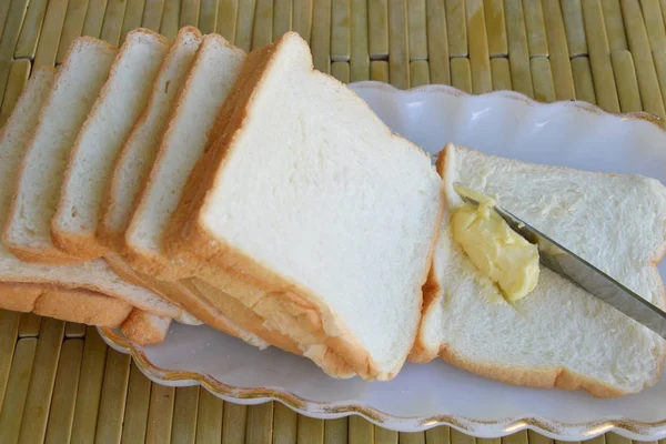 Bread and butter with table knife — Stock Photo, Image