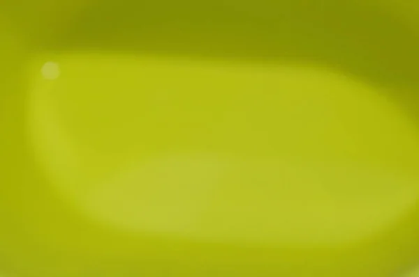 Blurry water in yellow plastic basin — Stock Photo, Image