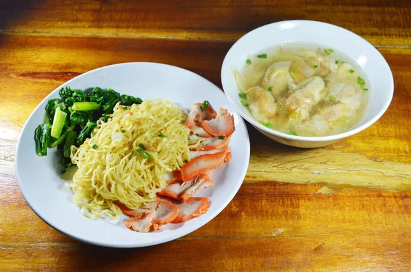 Chinese egg noodle with barbecue pork and boiled dumpling soup