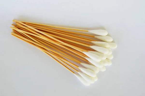 Cotton bud with long wooden stick on white background — Stock Photo, Image