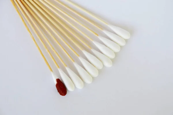 Cotton bud with iodine solution on white background — Stock Photo, Image