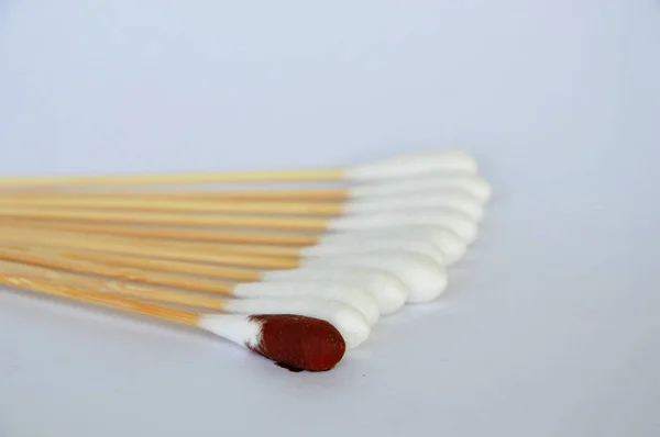 Cotton bud with iodine solution on white background — Stock Photo, Image