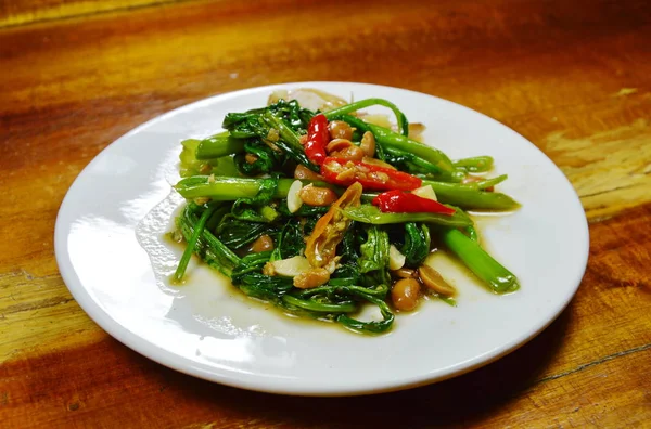 stir fried water spinach with chili and soy bean paste on dish