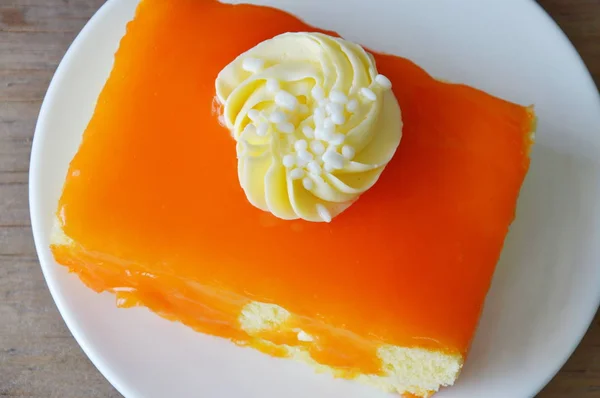 Confiture de gâteau au beurre d'orange crème garniture sur plat — Photo