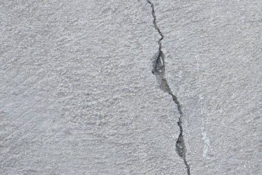 Çimento patika doku ve arka plan üzerinde çatlamak