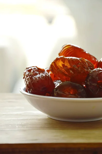 Chinese jujube candy coating syrup on little cup — Stock Photo, Image