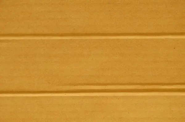 Marrone scatola di carta dura linea di piega sfondo e texture — Foto Stock
