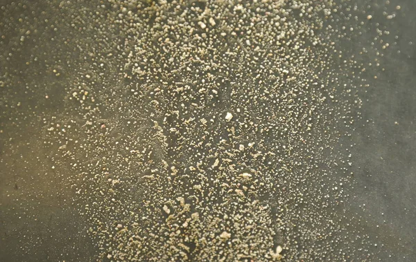 Zand en stof vlekken op zwarte kunststof bin — Stockfoto