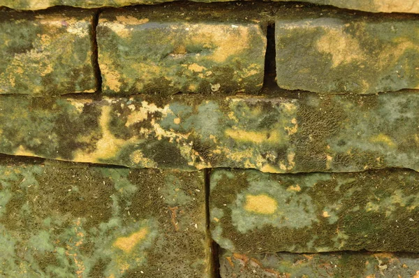 Costruzione muro di mattoni con sfondo macchia e texture — Foto Stock