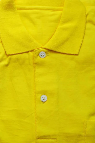 노란색 스포츠 셔츠 접어 텍스처 및 배경 닫기 — 스톡 사진