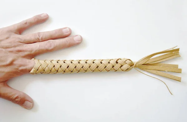 Thai folk wisdom toy equipment by putting finger in hole tight and shake for protect trigger finger — Stock Photo, Image