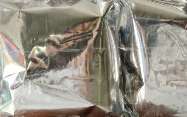 snack package in aluminum foil wrapped with clear plastic bag