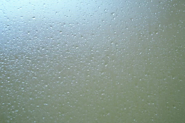 Goccia d'acqua sulla porta del bagno di vetro — Foto Stock