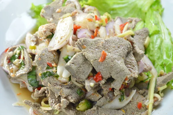 Spicy slice boiled pork liver salad with herb on plate — Stock Photo, Image