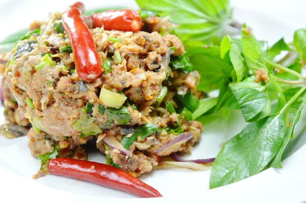 Spicy minced catfish with herb topping red chili Thai salad on plate — Stock Photo, Image