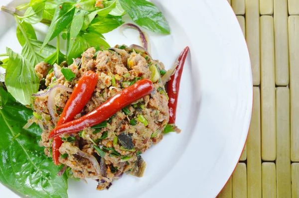 Spicy minced catfish with herb topping red chili Thai salad on plate — Stock Photo, Image