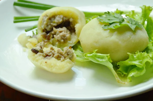 Mashed steamed potato stuffed fried minced pork and mushroom on white plate — Stok Foto