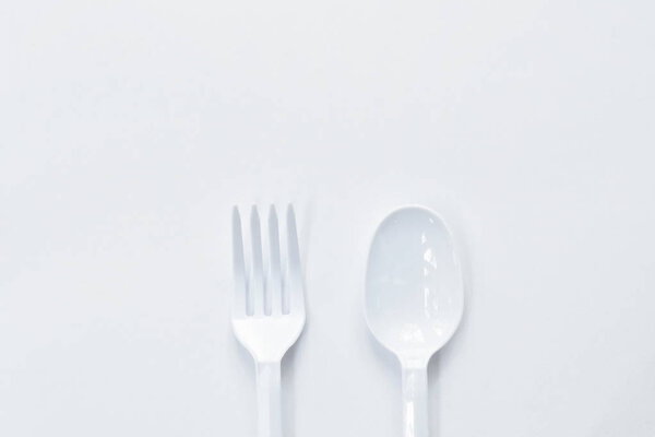  plastic spoon and fork for single used on white background