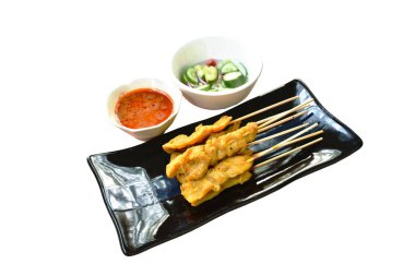 pork satay with sweet peanut sauce and pickled vegetable cup