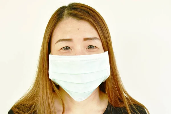 Asian woman wearing hygienic mask robe for protection nose and mouth from virus