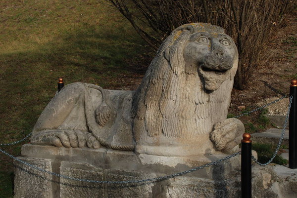 The sculpture of a lion in the park Olesko castle
