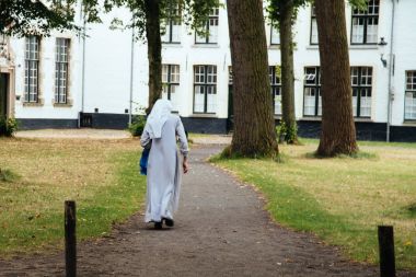 Nun walk on the park clipart