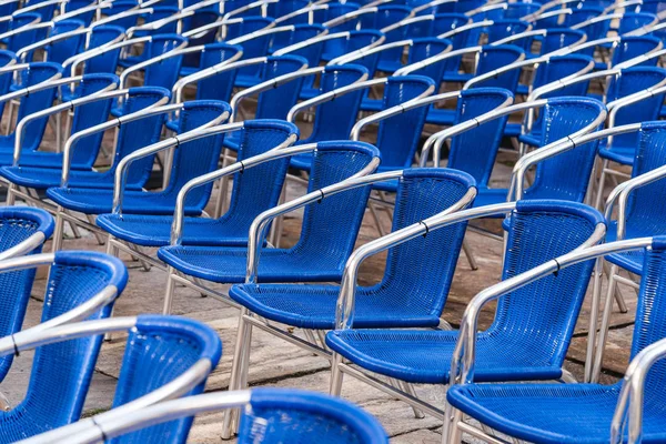 Blue chairs in outdoors event