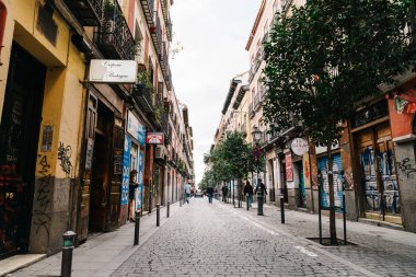 Street scene in Malasana district in Madrid clipart