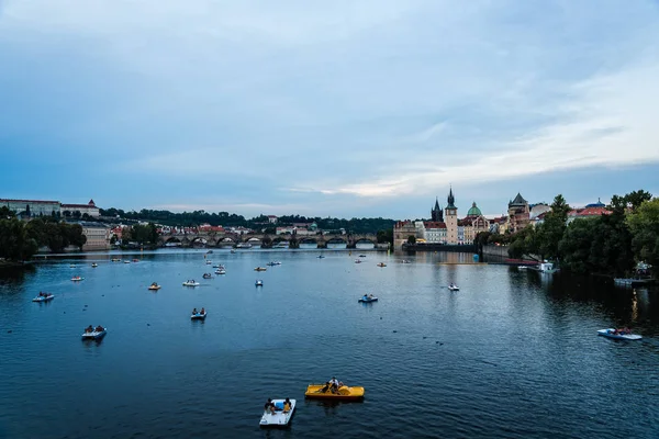 Touristic boats on River against Prague cityscape — Stock Photo, Image