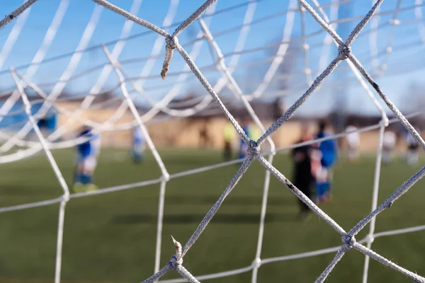 Soccer goal net against blurred background