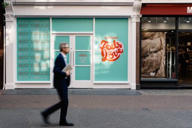 People moving in front of retail space for rent in Carnaby Street, Soho, London clipart