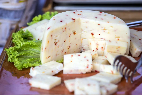 Italian cheese with hot chili pepper — Stock Photo, Image