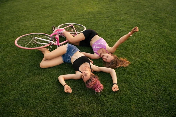 Two happy girls on bicycle — Stock Photo, Image