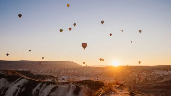 Colorful air balloons flying over Cappadocia landscape at sunris — Stock Photo, Image