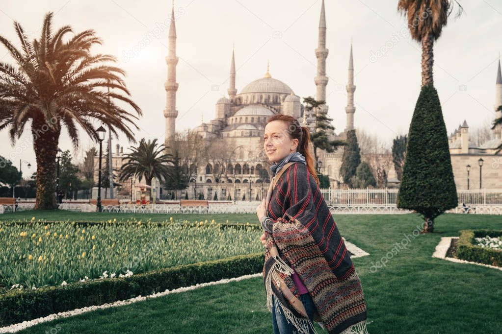 Blue mosque of Istanbul and young traveler in foreground