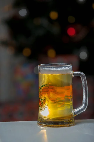 Mug of beer on wooden background