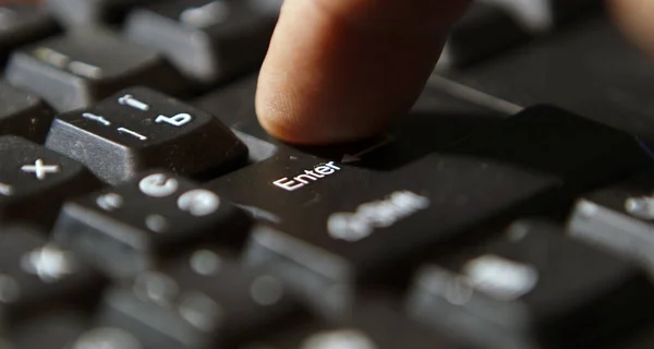 Black computer keyboard super close up stock footage. Enter keys