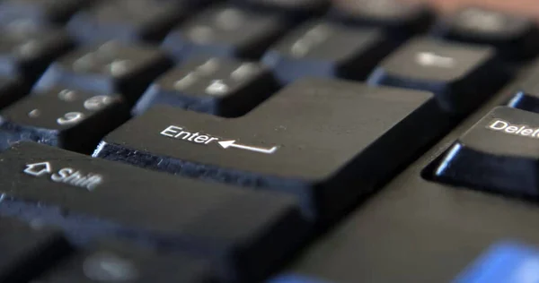 Black computer keyboard super close up stock footage. Enter keys